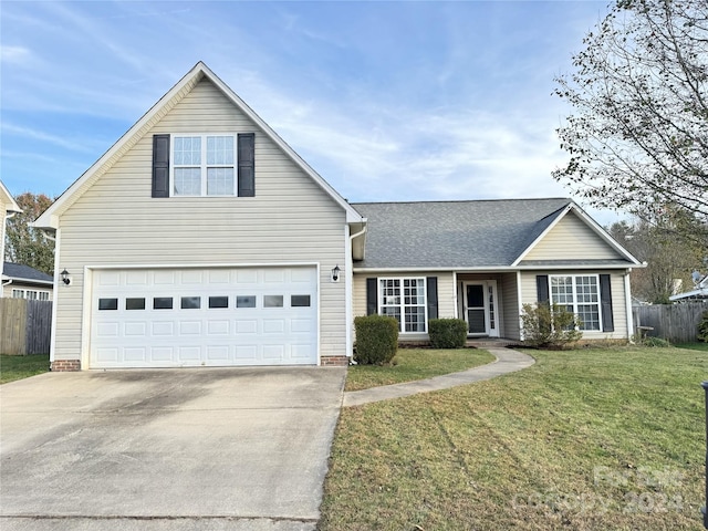 front of property featuring a front yard and a garage