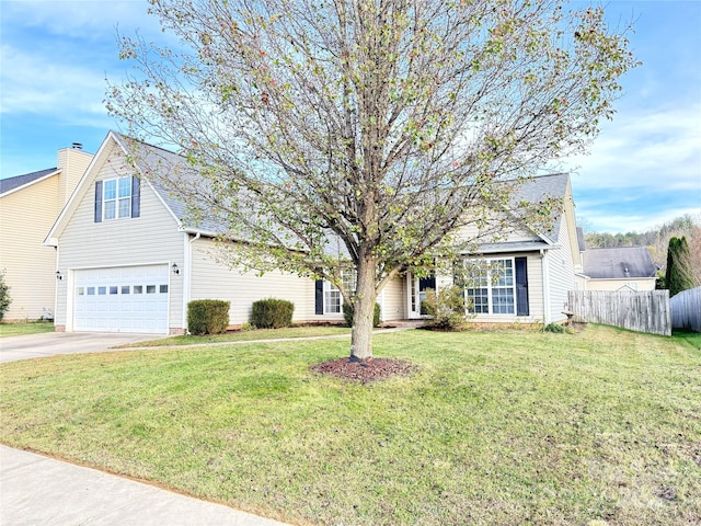 view of front of property with a front yard and a garage