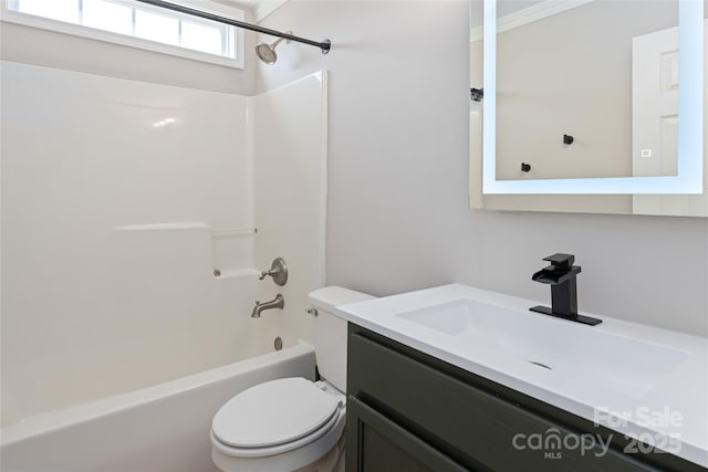 bathroom featuring shower / bath combination, toilet, and vanity