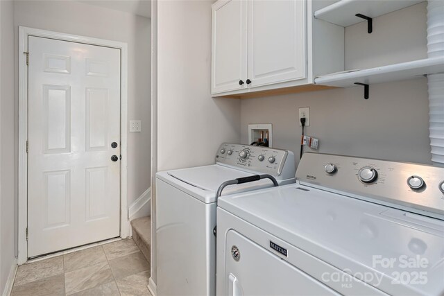 laundry room with cabinet space and washing machine and dryer