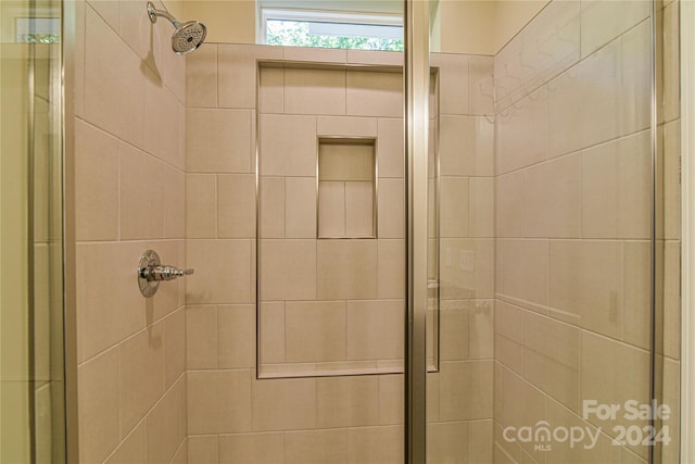 bathroom with an enclosed shower