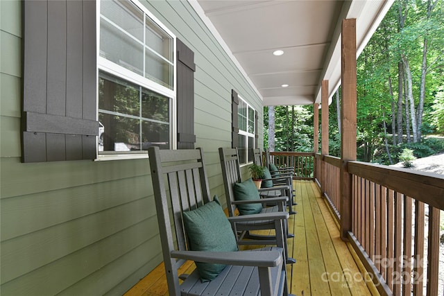 wooden terrace with a porch