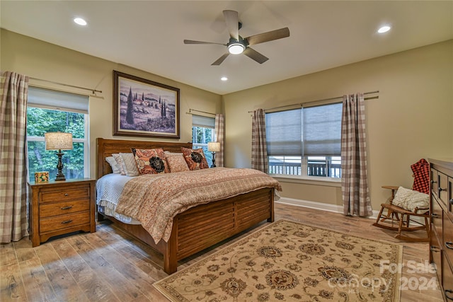 bedroom with ceiling fan and wood-type flooring