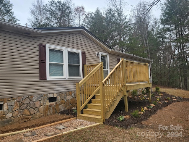 doorway to property with a deck