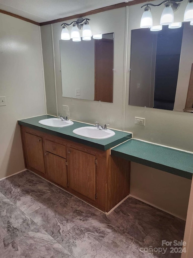 bathroom with vanity and ornamental molding