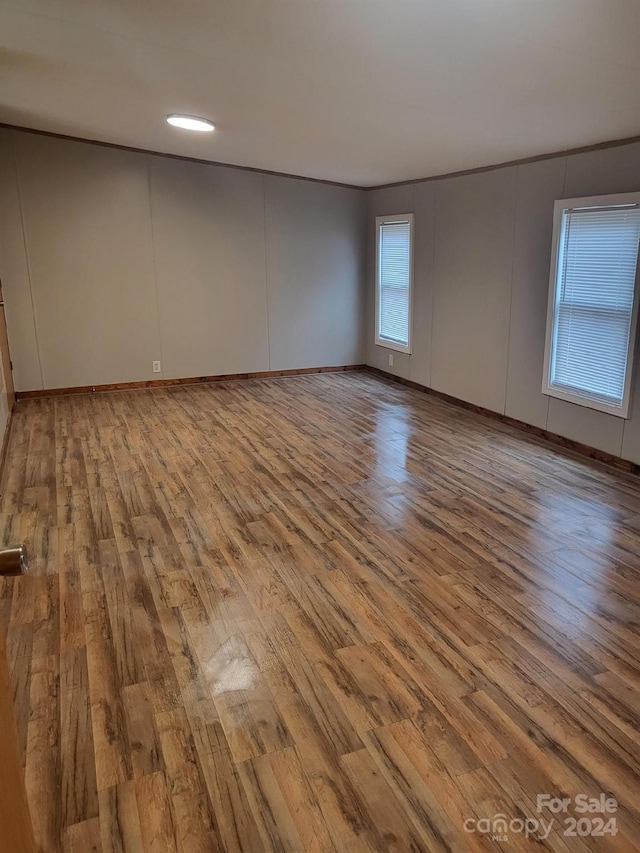 spare room featuring light wood-type flooring