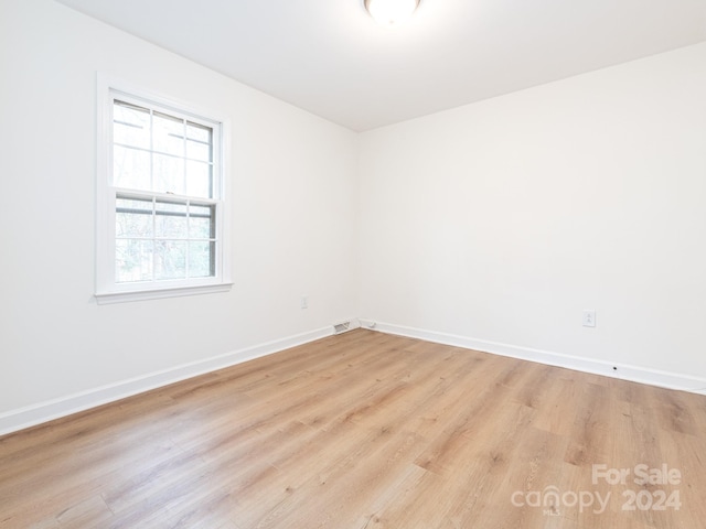 spare room with light wood-type flooring