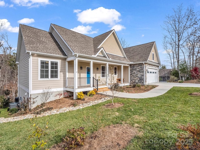 view of front of home featuring central AC, a front lawn, and covered porch