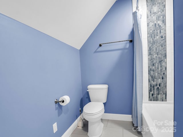 bathroom with vaulted ceiling, toilet, tile patterned flooring, and shower / tub combo