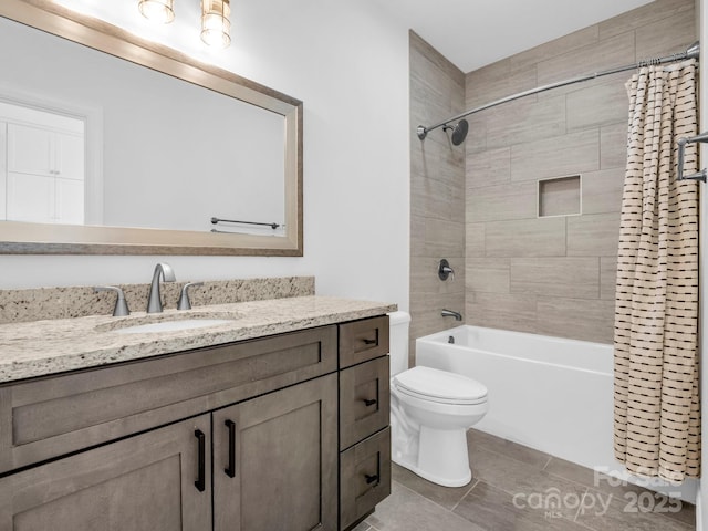 full bathroom with shower / tub combo with curtain, vanity, and toilet