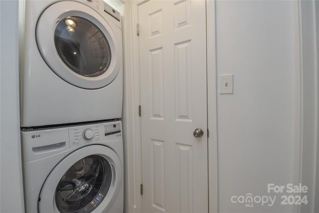 laundry area featuring stacked washer and dryer