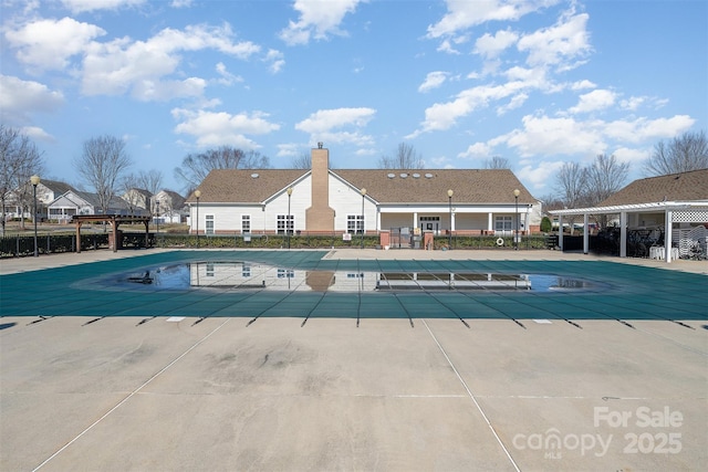 view of swimming pool with a patio