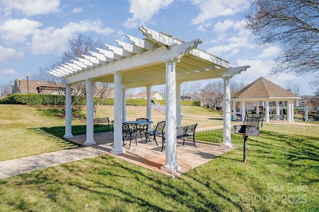 view of property's community with a gazebo, a pergola, and a lawn