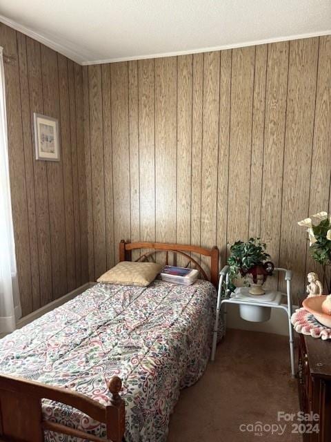 carpeted bedroom with wooden walls