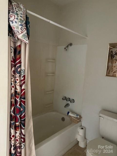 bathroom with toilet and shower / tub combo