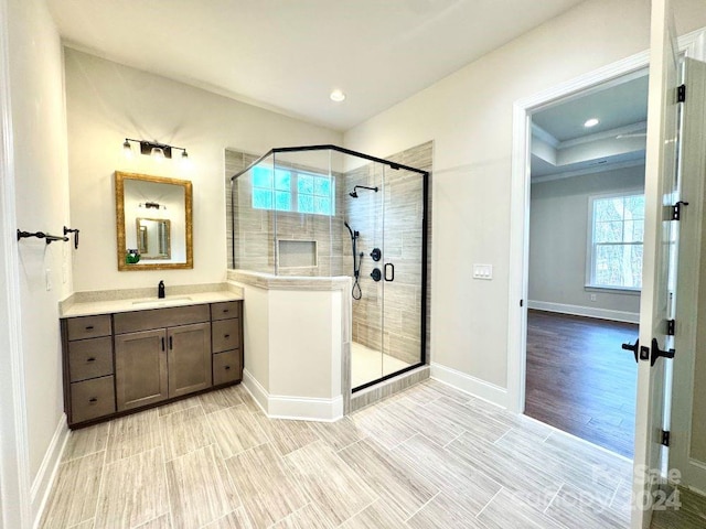 bathroom with vanity and an enclosed shower