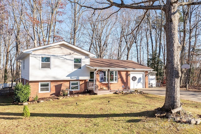 tri-level home with a front yard and a garage