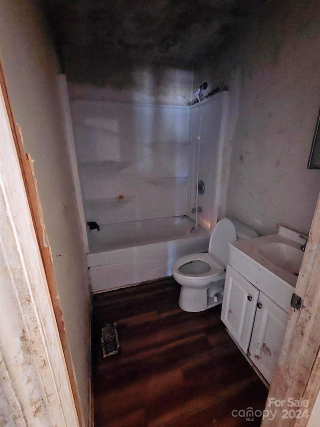 full bathroom with hardwood / wood-style floors, vanity, toilet, and shower / bathing tub combination