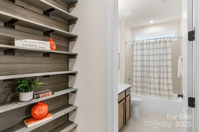 full bathroom with tile patterned floors, vanity, shower / tub combo, and toilet