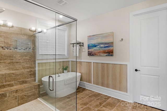 bathroom with shower with separate bathtub