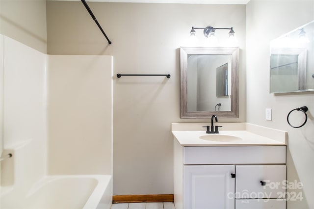 bathroom with vanity, tile patterned floors, and shower / bathtub combination