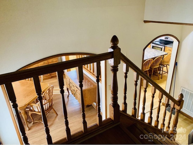 stairs with hardwood / wood-style flooring