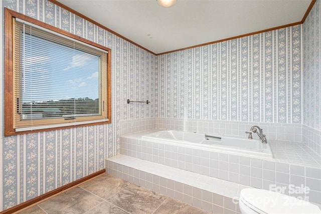 bathroom featuring wallpapered walls, baseboards, and a garden tub