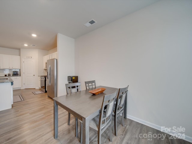 dining space featuring light hardwood / wood-style floors