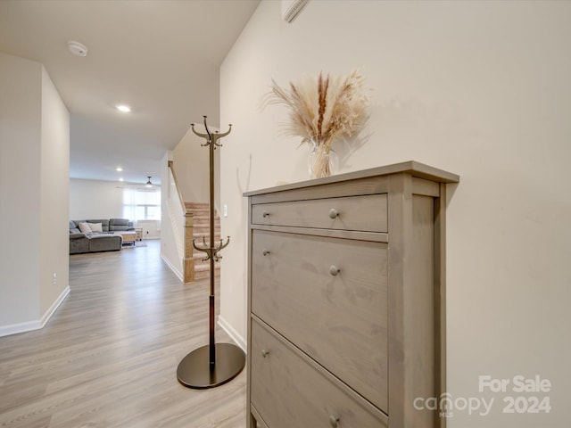 hall with light hardwood / wood-style flooring