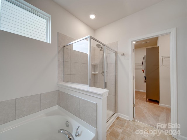 5021 Markfield Ln, Monroe, NC 28110 - bathroom with a shower stall, a spacious closet, and a bath