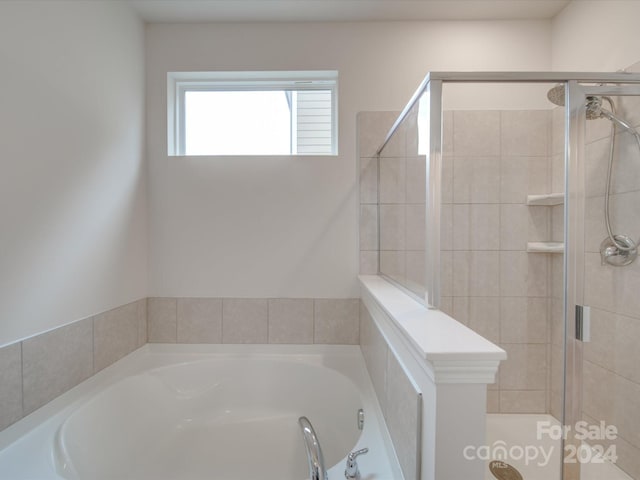 bathroom featuring plus walk in shower