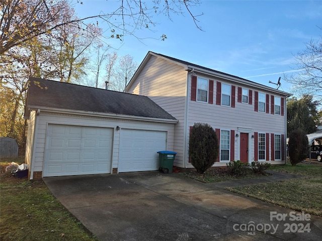 colonial home with a garage