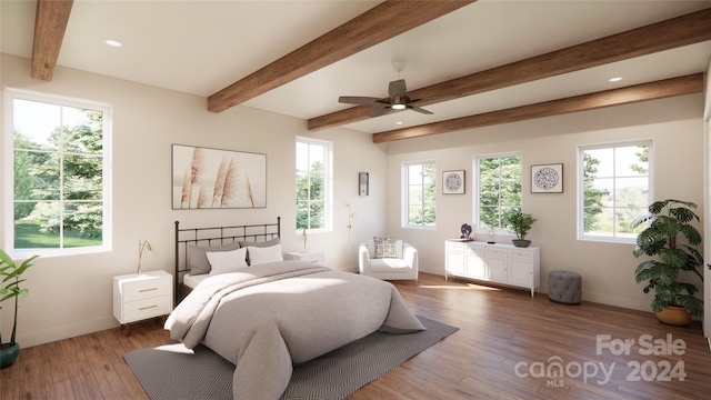 bedroom with hardwood / wood-style floors, ceiling fan, and beamed ceiling