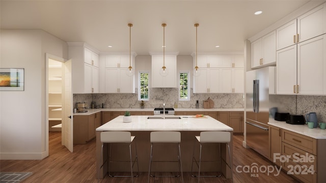 kitchen featuring white cabinets, a center island with sink, and dark hardwood / wood-style floors