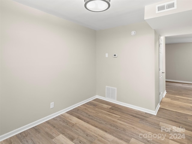 spare room featuring light hardwood / wood-style floors