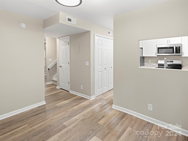 interior space with light hardwood / wood-style flooring