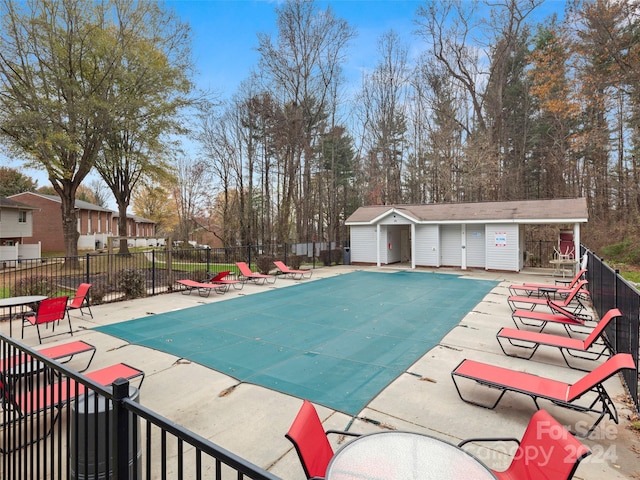 view of swimming pool featuring a patio area