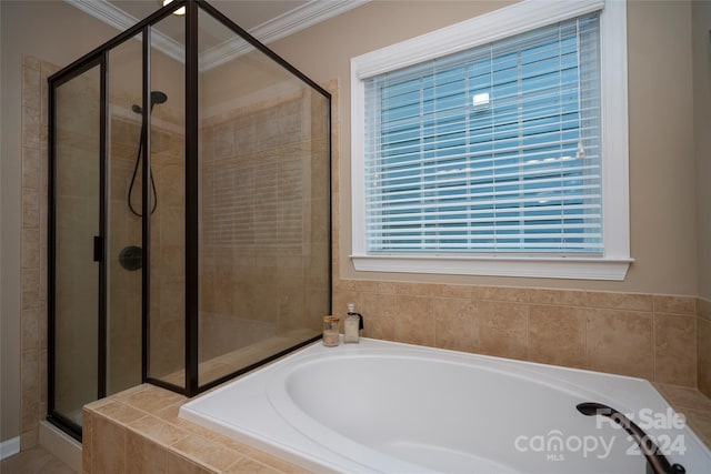 bathroom with separate shower and tub and crown molding