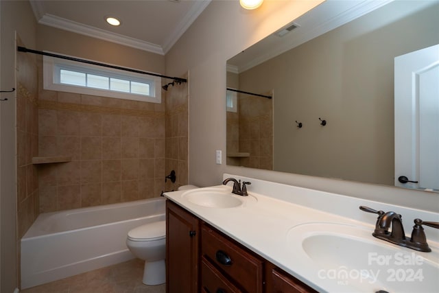 full bathroom featuring tile patterned floors, vanity, tiled shower / bath combo, crown molding, and toilet