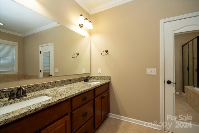 bathroom featuring tile patterned flooring, vanity, and ornamental molding