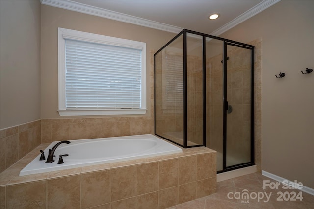 bathroom featuring tile patterned flooring, independent shower and bath, and ornamental molding