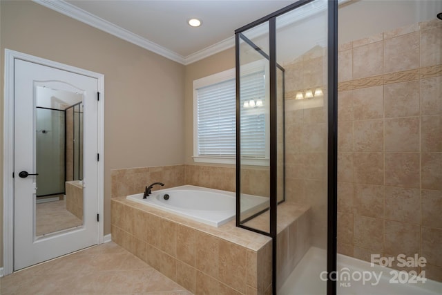 bathroom featuring separate shower and tub, tile patterned flooring, and ornamental molding