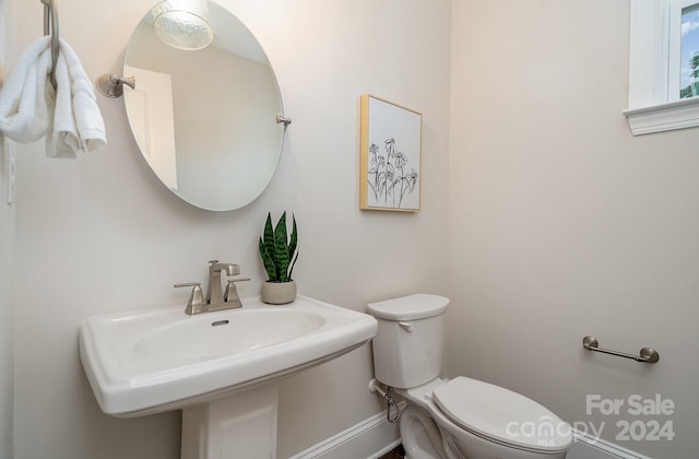 bathroom with toilet and sink