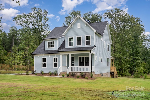 view of front of house featuring a porch and a front lawn