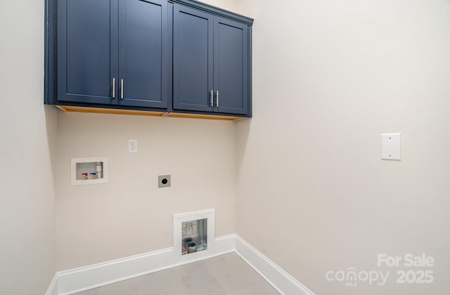 clothes washing area with washer hookup, cabinet space, electric dryer hookup, and baseboards