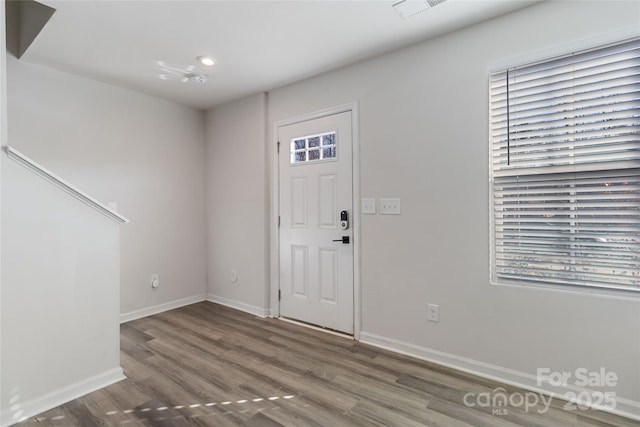 entryway with dark wood-type flooring