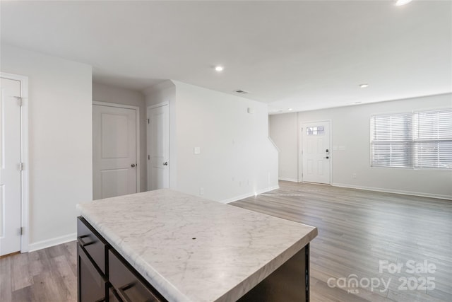 kitchen featuring light wood-type flooring and a center island