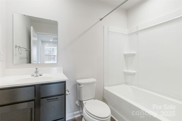 full bathroom featuring vanity, toilet, and washtub / shower combination