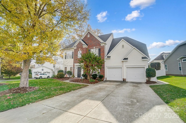 view of front of home with a front yard and a garage