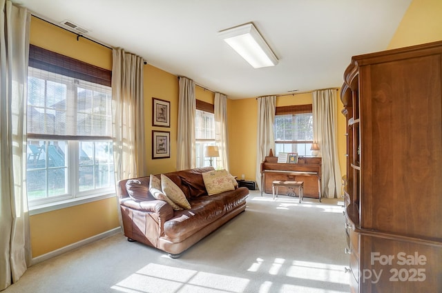 living area featuring light colored carpet